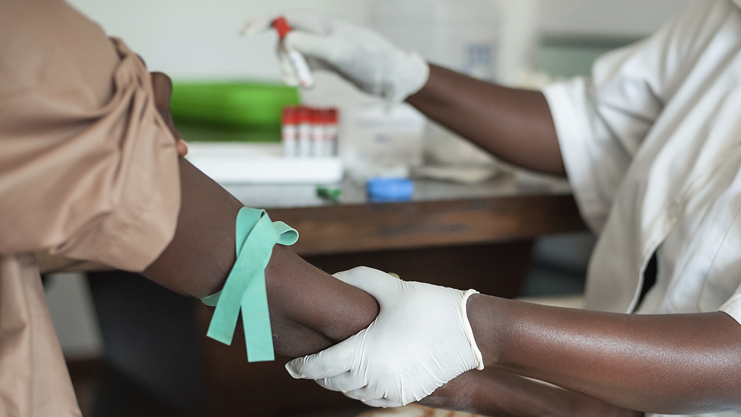 African nurse is drawing blood