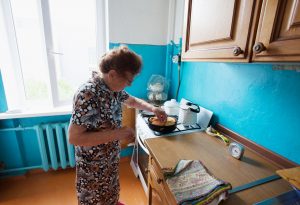 Elderly woman on the kitchen